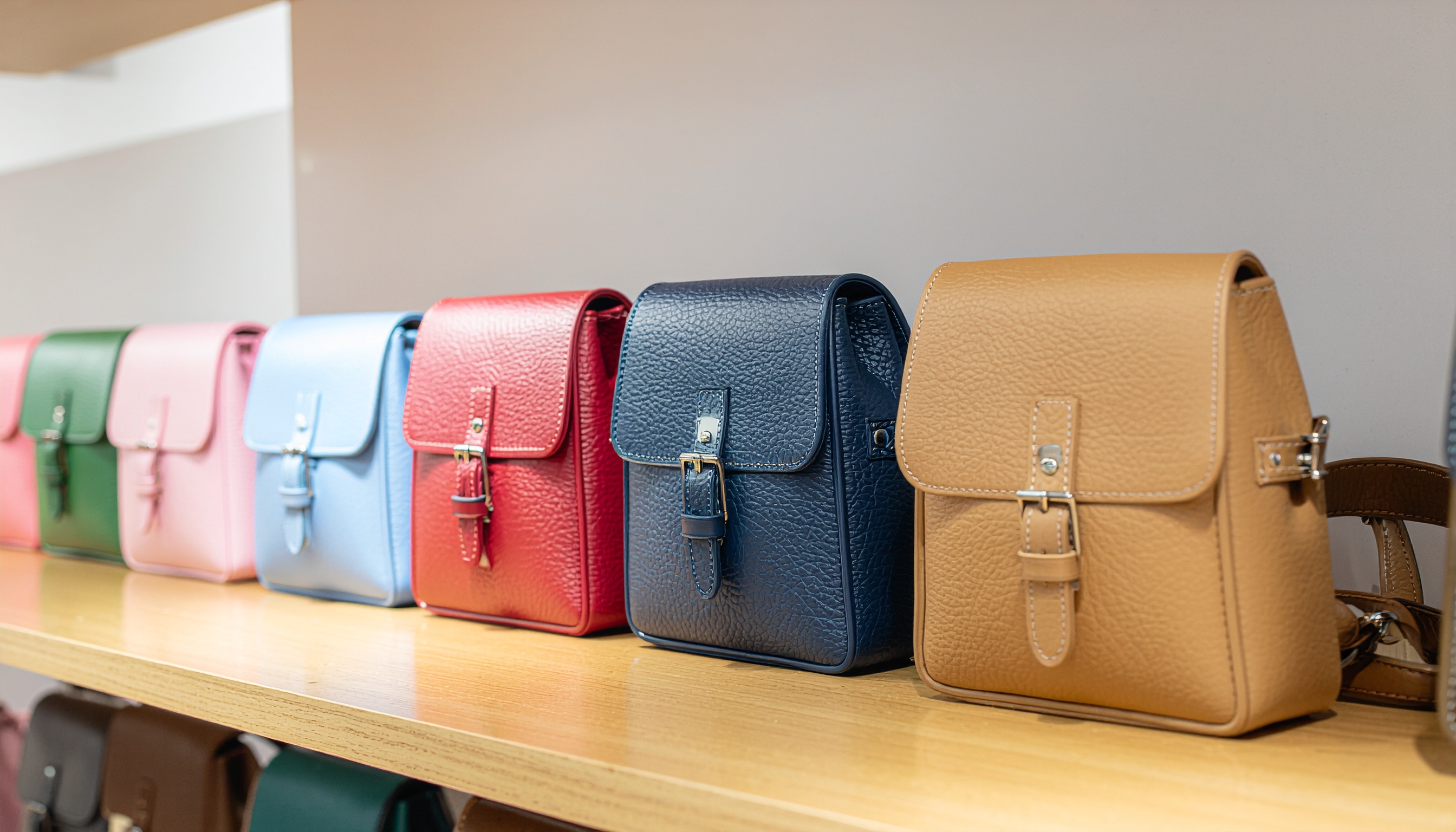 Leather Bags in Different Colors on a Shelf