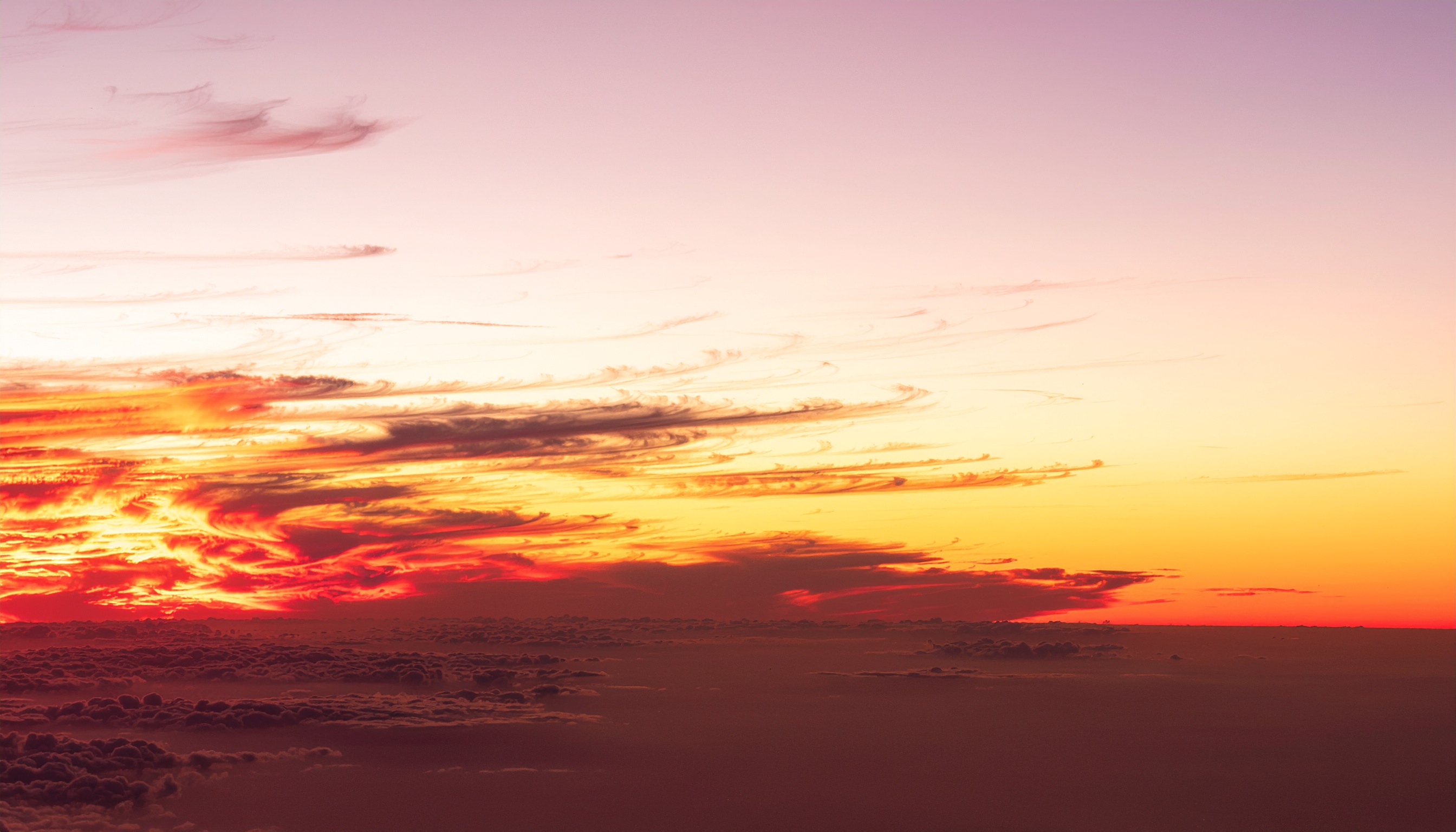 Sunset Gradient Over a Sea of Clouds