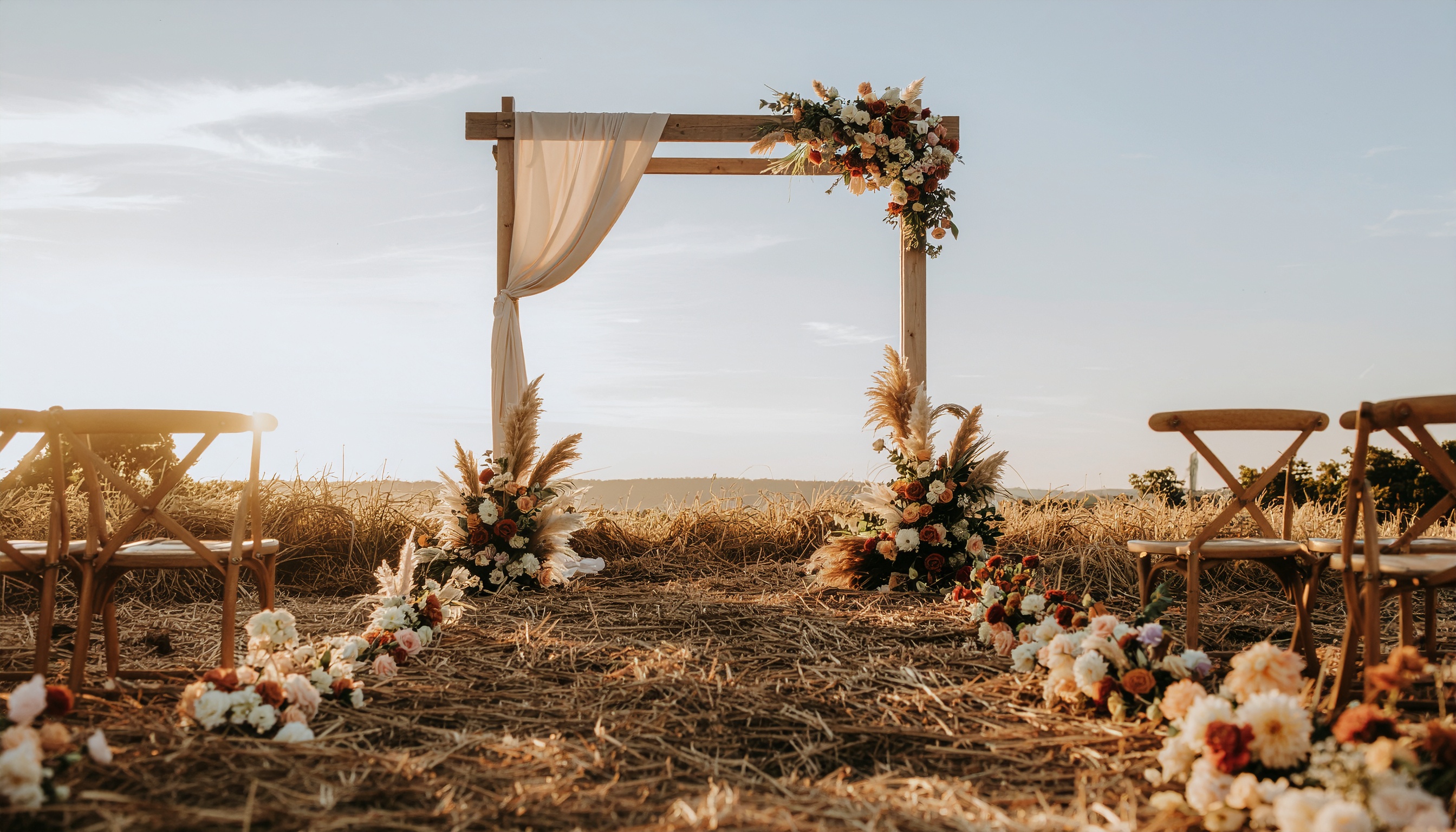 Outdoor Wedding Arch with Terracotta Flowers
