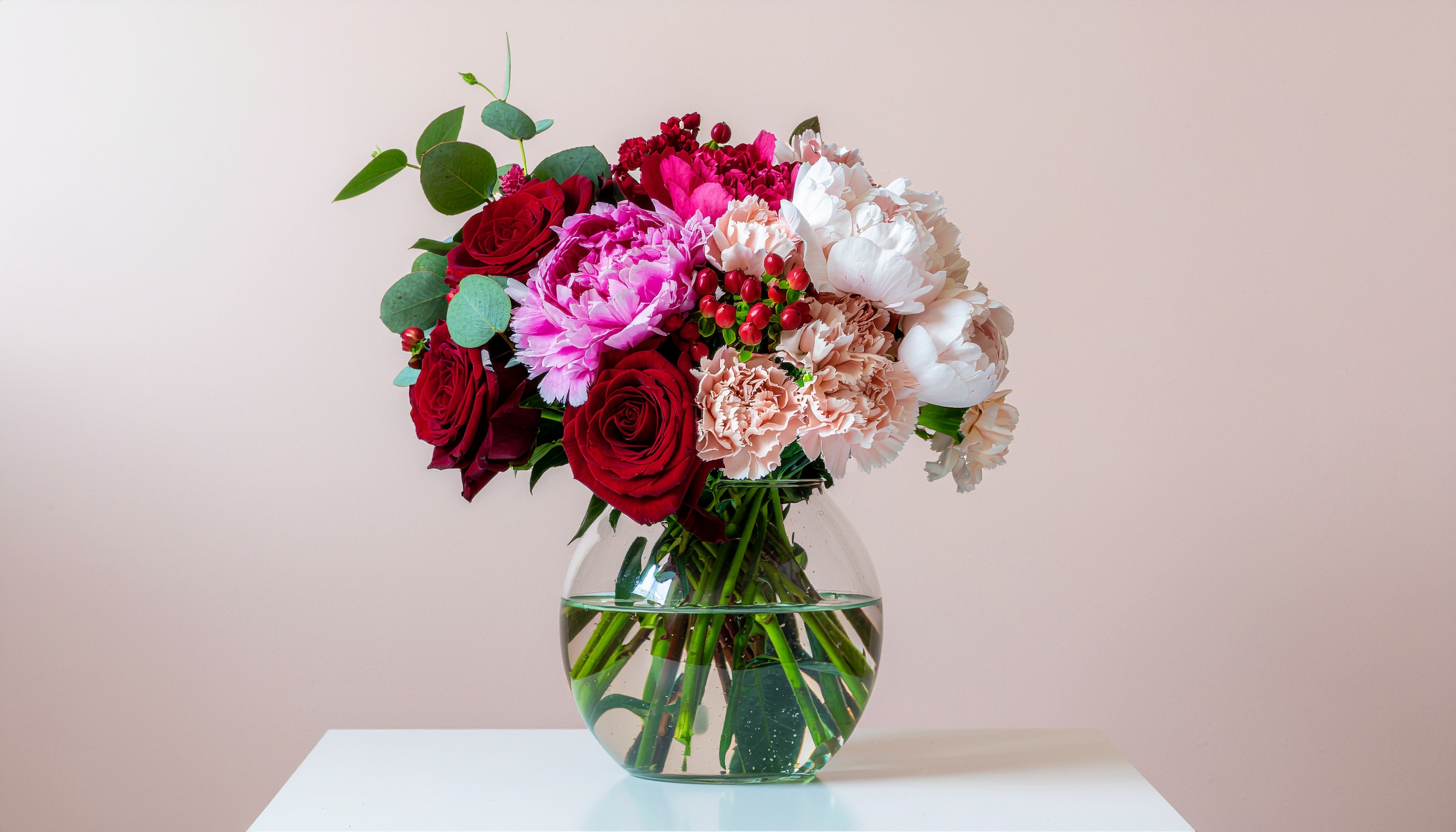 Red and Pink Bouquet in a Glass Vase